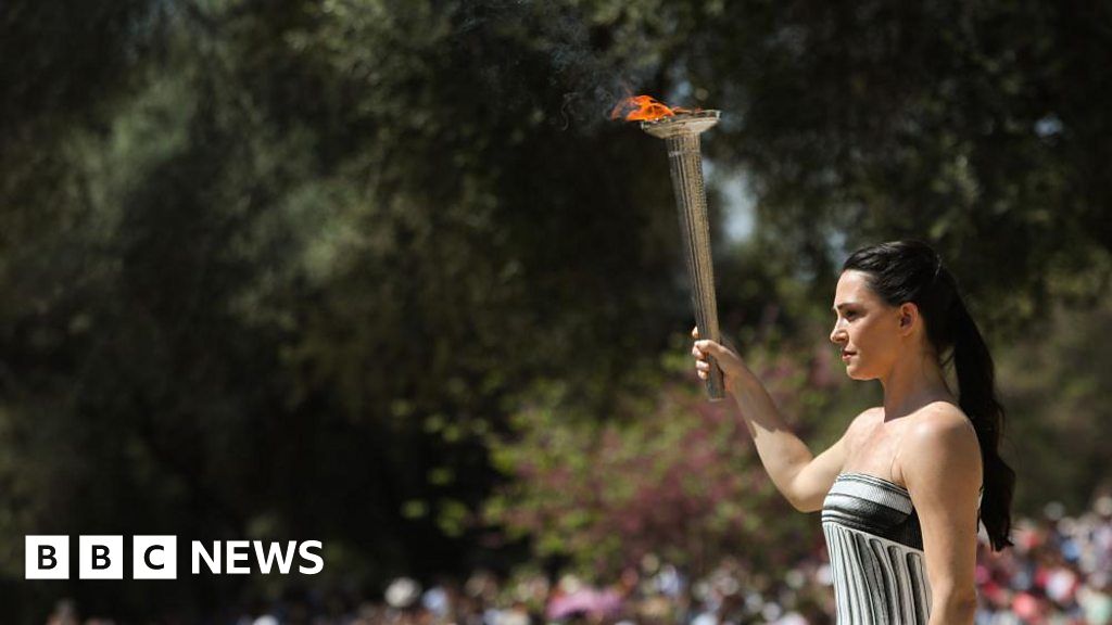 Featured image for "Olympic Torch Journey Hindered by Cloudy Skies and Security Concerns"