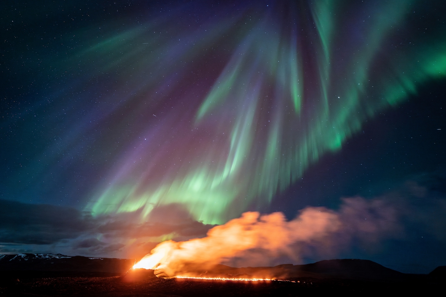 "Northern Lights Illuminating Erupting Volcanoes Around the World"