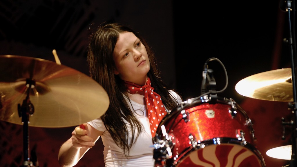 Featured image for Jack White defends Meg White's drumming ability amidst criticism and controversy.