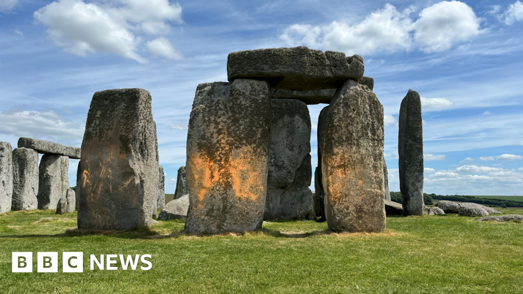 Featured image for Two Charged for Orange Paint Attack on Stonehenge in Protest