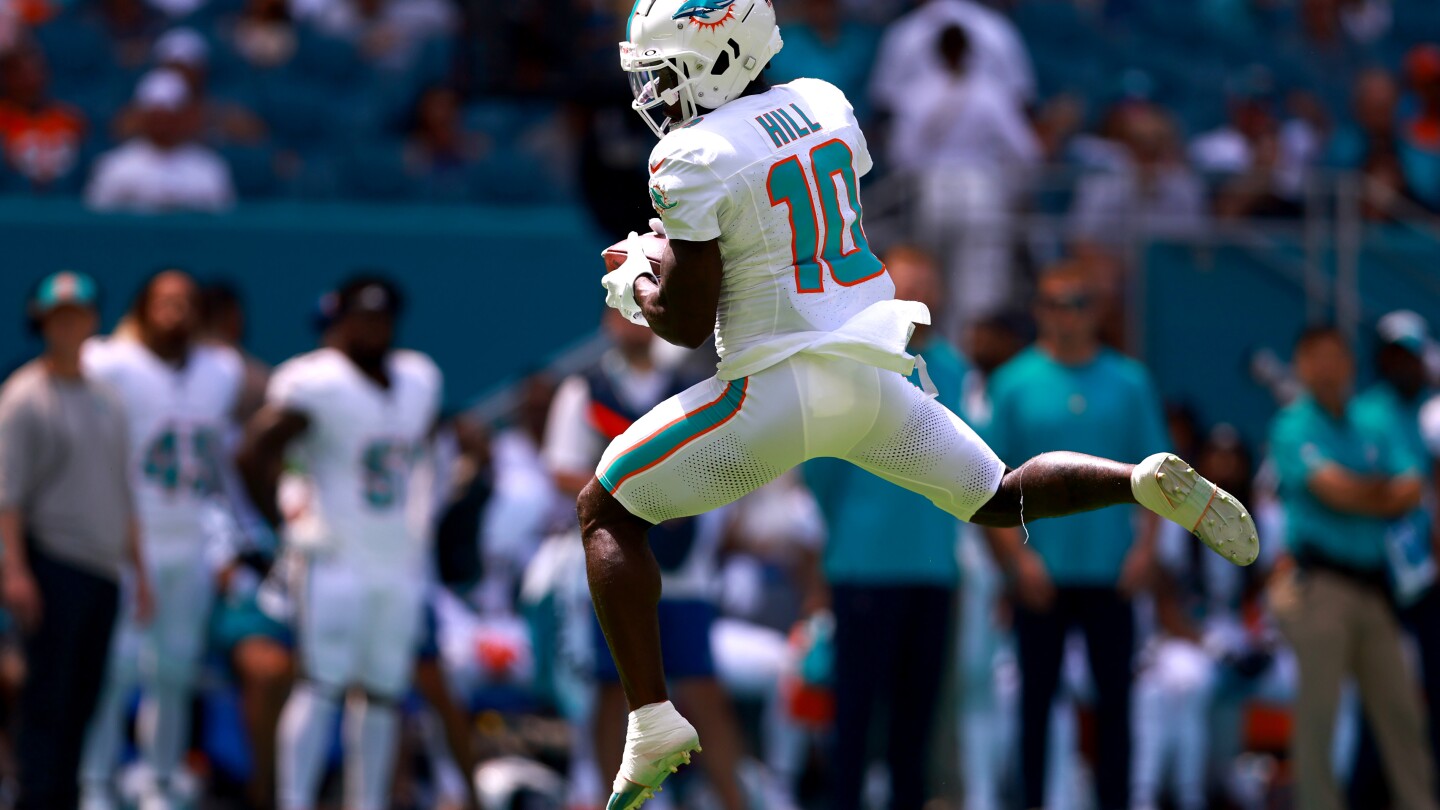 "Dolphins' Speedsters Set Records and Dominate NFL"