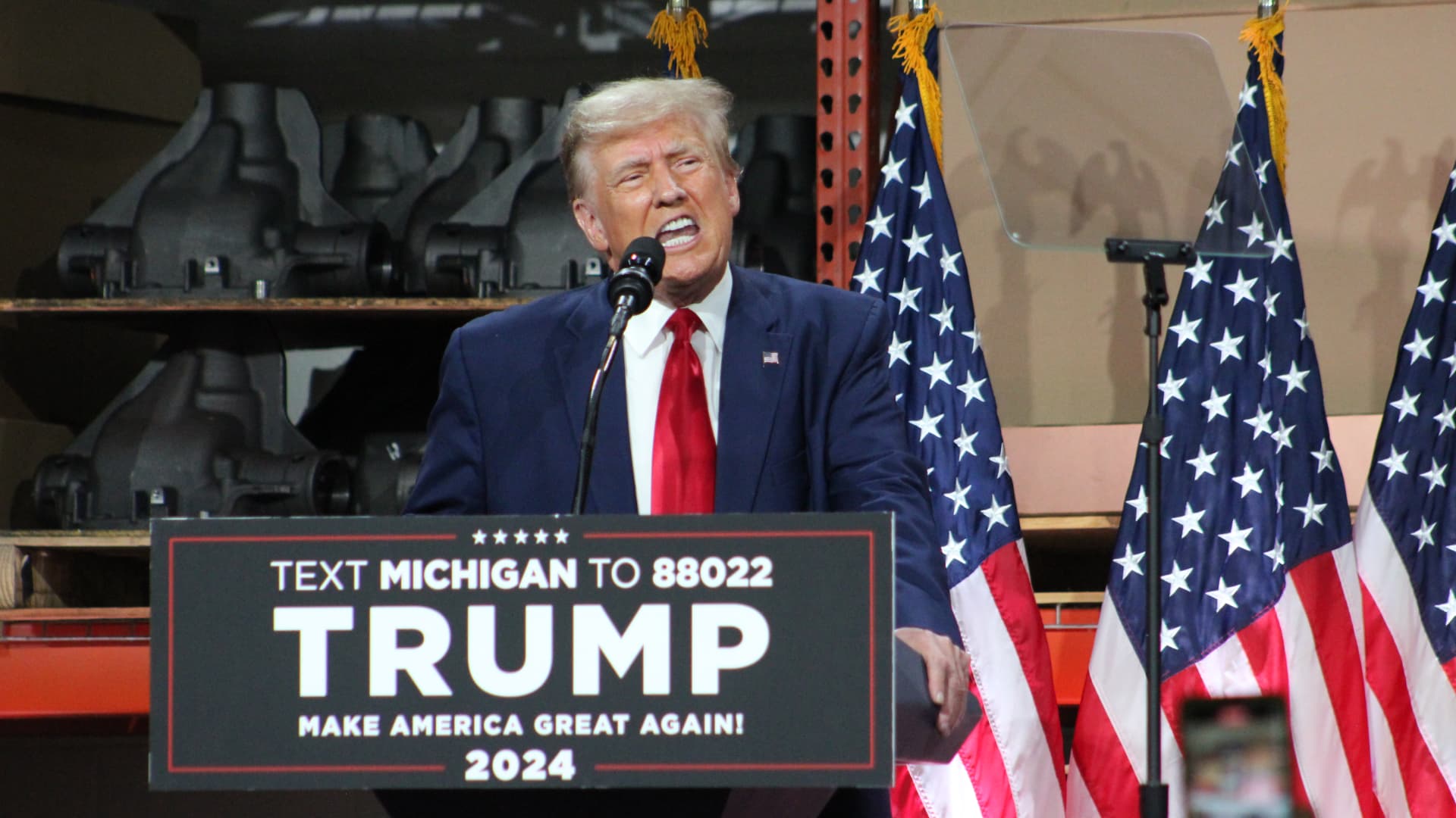 "Trump's Controversial Michigan Visit: UAW Endorsement, EV Criticism, and Union Strike Condemnation"