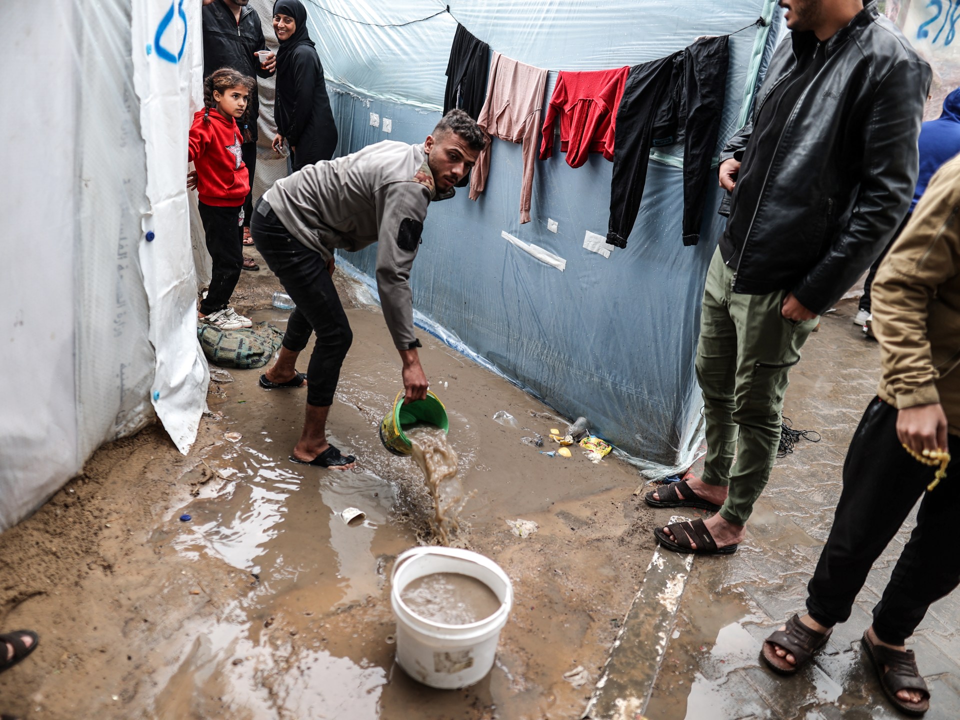 "Displaced Palestinians face harsh weather and dire conditions amidst Gaza's worsening humanitarian crisis"