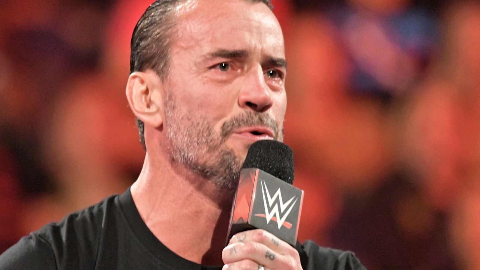 Featured image for CM Punk's Injury Impact: Reactions and WrestleMania Announcement