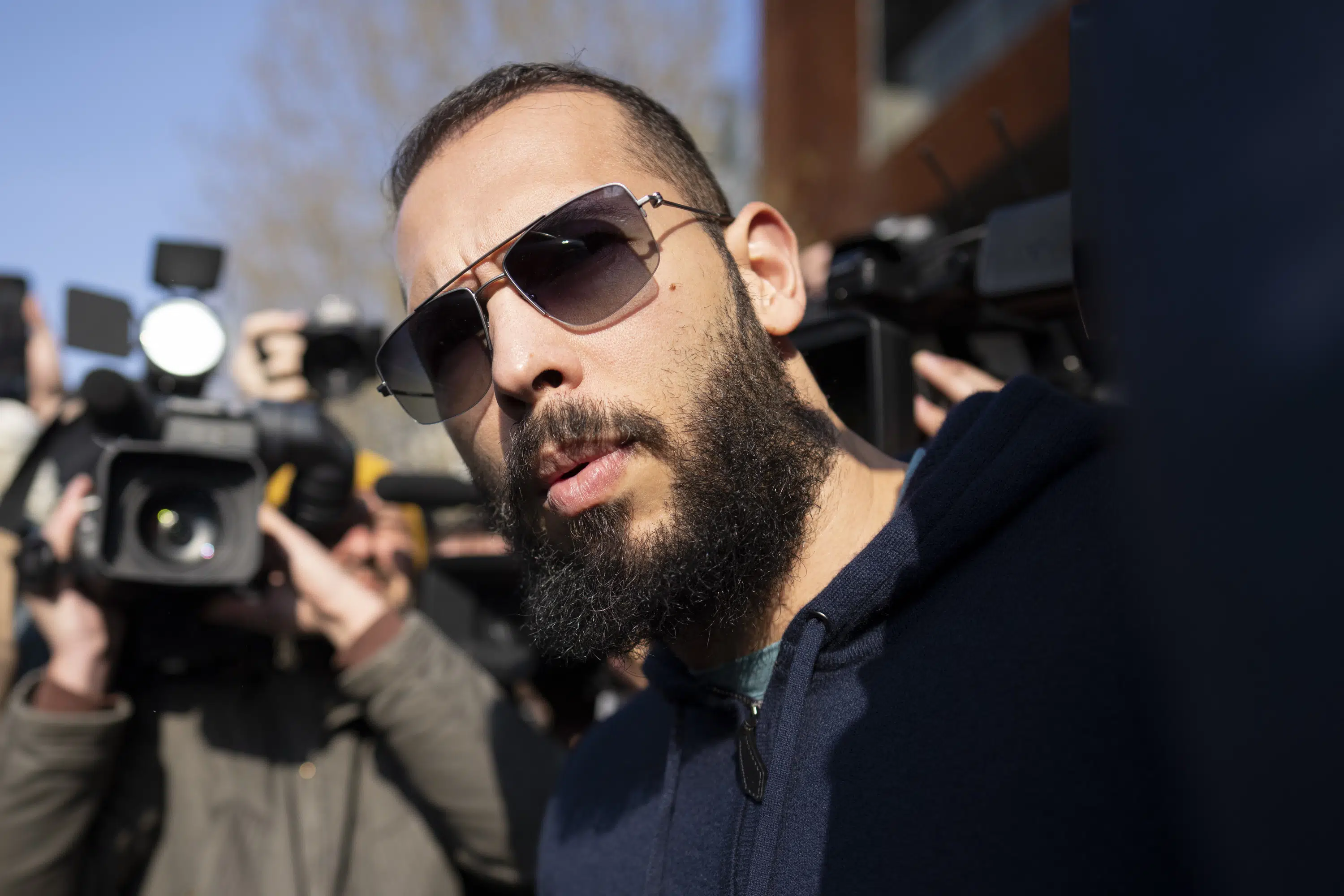 Prosecutors seize devices in Andrew Tate investigation.