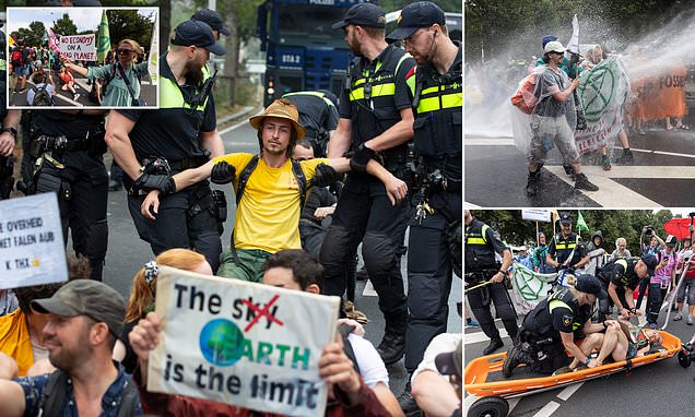 Featured image for "Dutch Police Deploy Water Cannon to Disperse Climate Activists Blocking Highways"