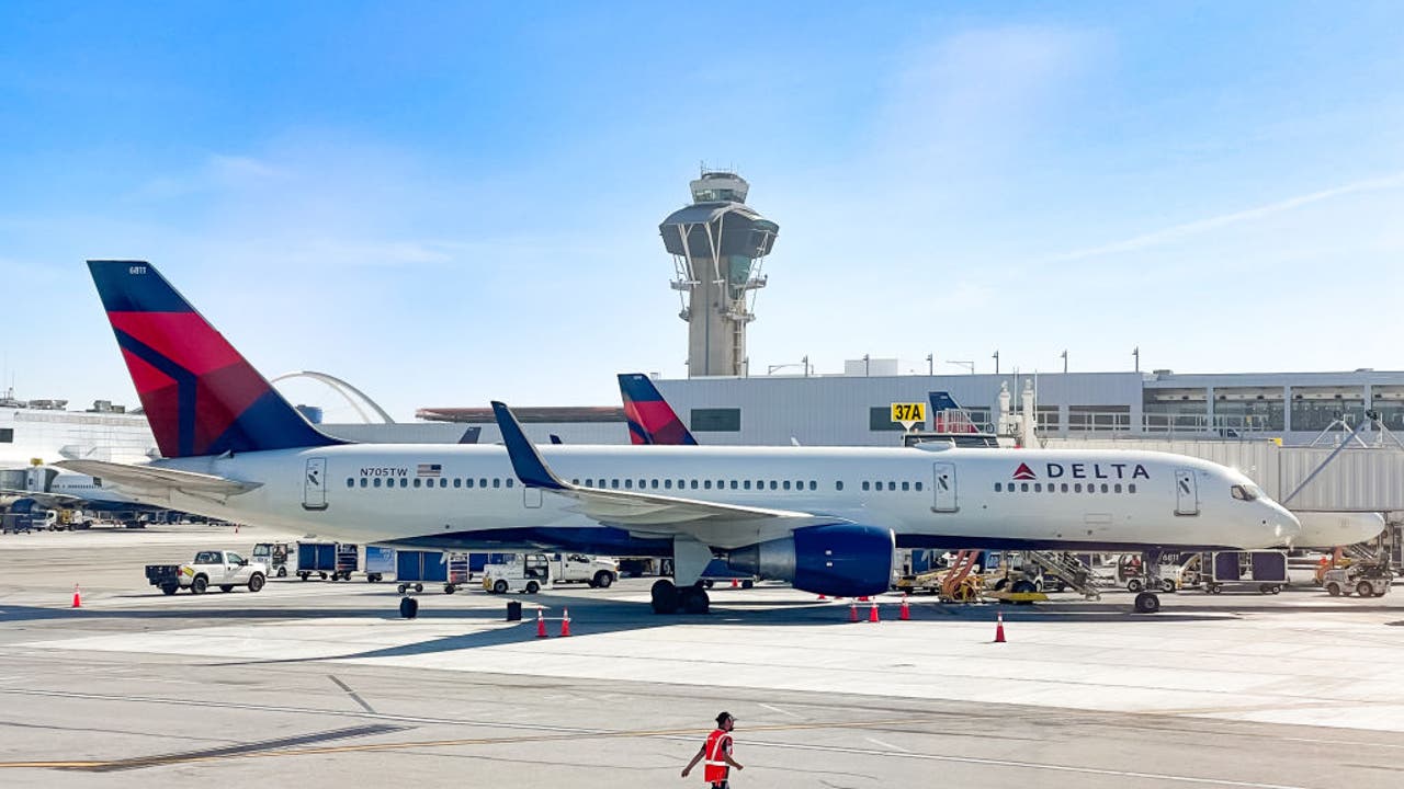 Flight passenger detained for opening emergency exit door on LAX-Seattle route.