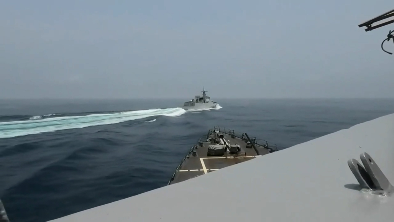 Tensions rise as Chinese warship sails dangerously close to US destroyer in Taiwan Strait.
