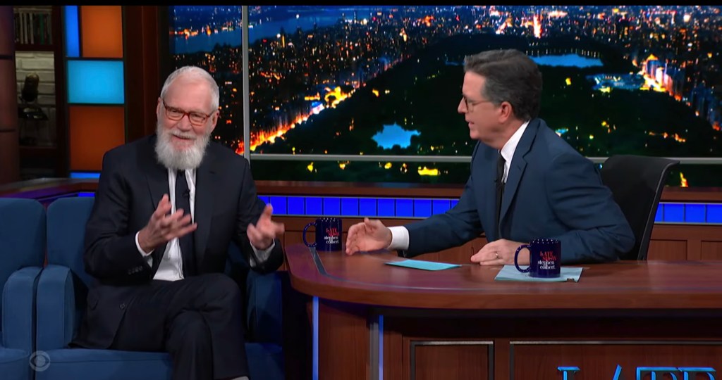 Featured image for "David Letterman Reflects on Johnny Carson's Legendary Status During Visit with Stephen Colbert"