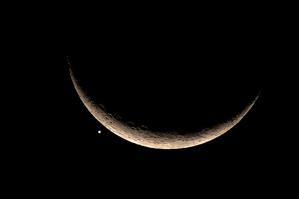Rare celestial event: Moon eclipses Jupiter and Mercury in conjunction.