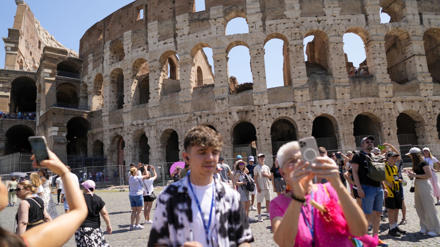 Officials search for vandal who carved into Rome's Colosseum.