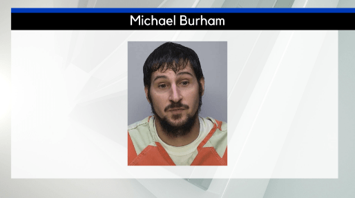 "Escaped Murder Suspect Michael Burham Evades Capture with Possible Assistance"