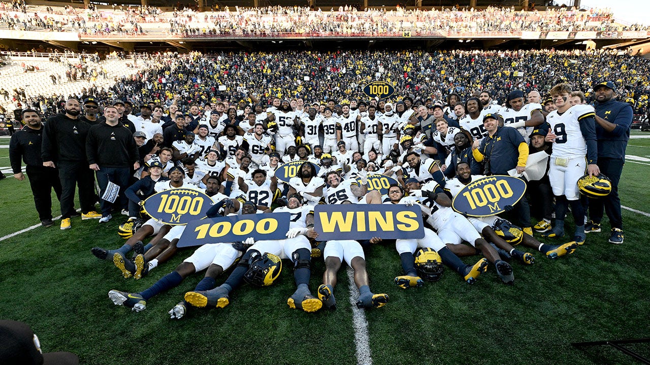 Featured image for "Michigan Football Makes History with 1,000th Win and Undefeated Streak Amidst Harbaugh's Ban"