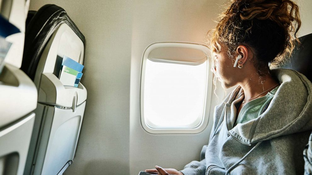 "In-Flight Etiquette: Navigating Window Seat Disputes with Ease"