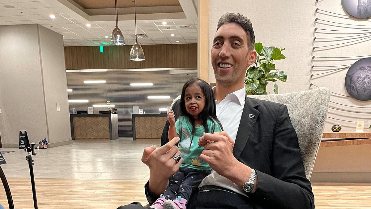 Featured image for "World's Tallest Man Reunites with Shortest Woman After Six Years"