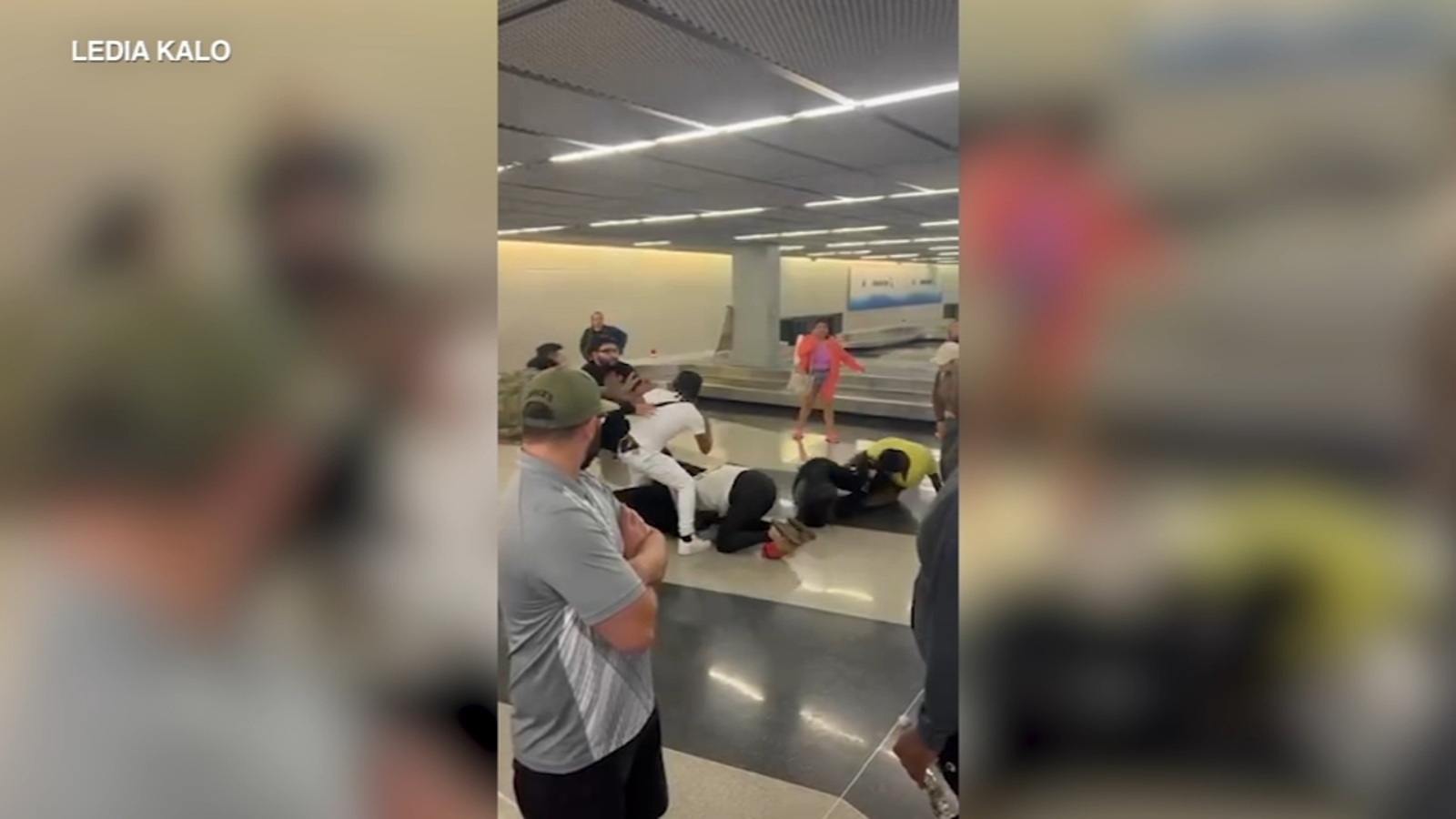 2 arrested after massive brawl at Chicago's O'Hare Airport baggage claim caught on camera.