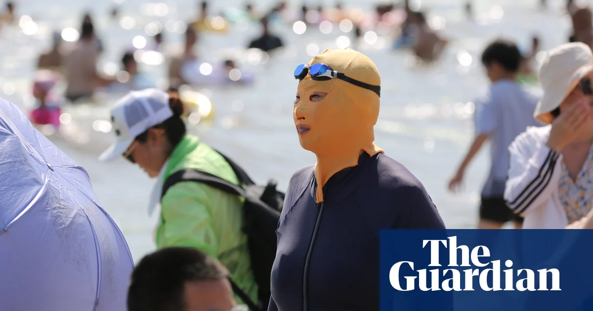 "China's 'Facekini' Trend Surges Amidst Soaring Temperatures"