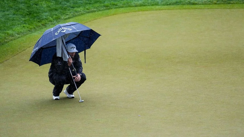 Jon Rahm's Frustrations Boil Over at Rain-Soaked PGA Championship.