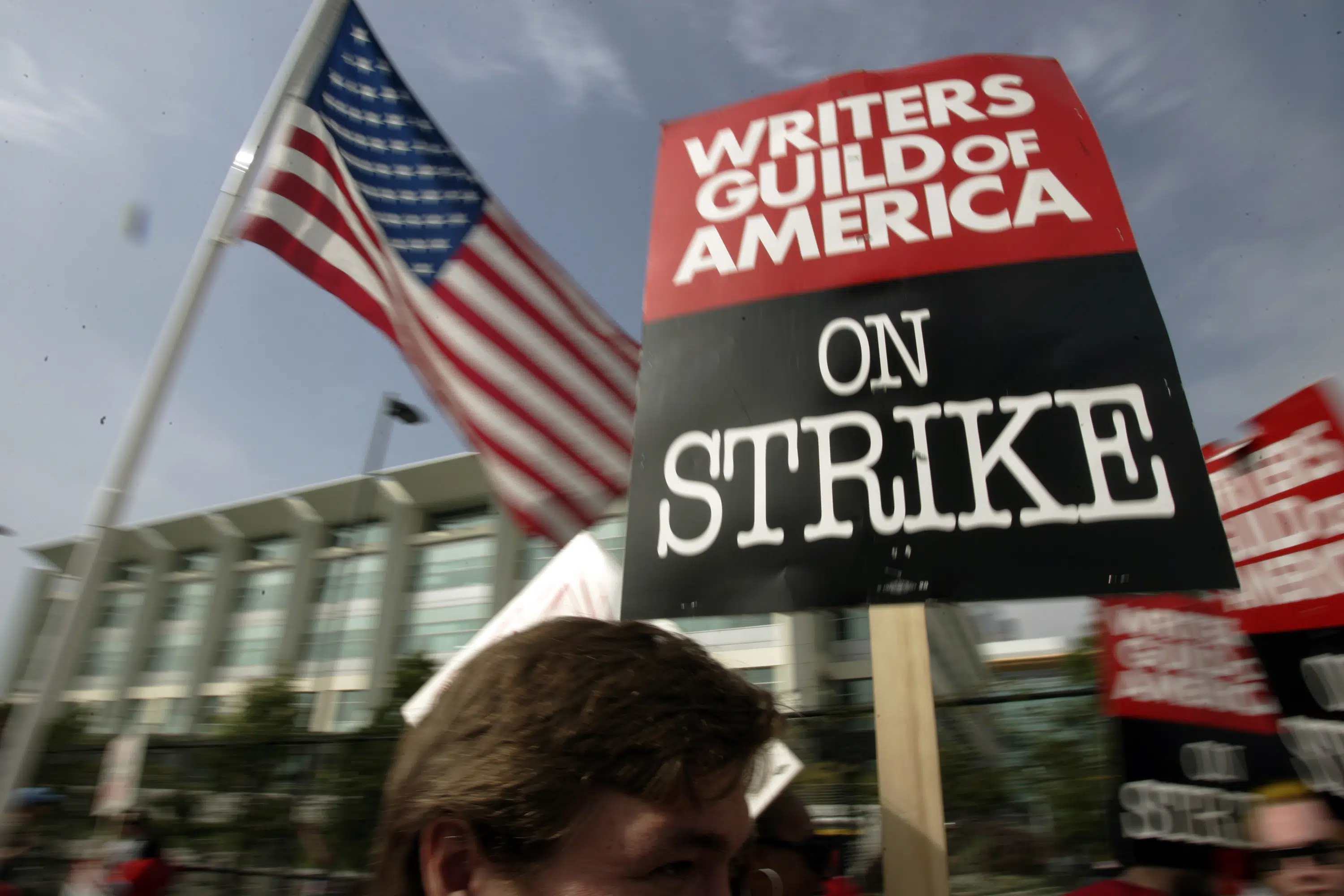 Featured image for Writers' strike causes production shutdowns and film industry turmoil.