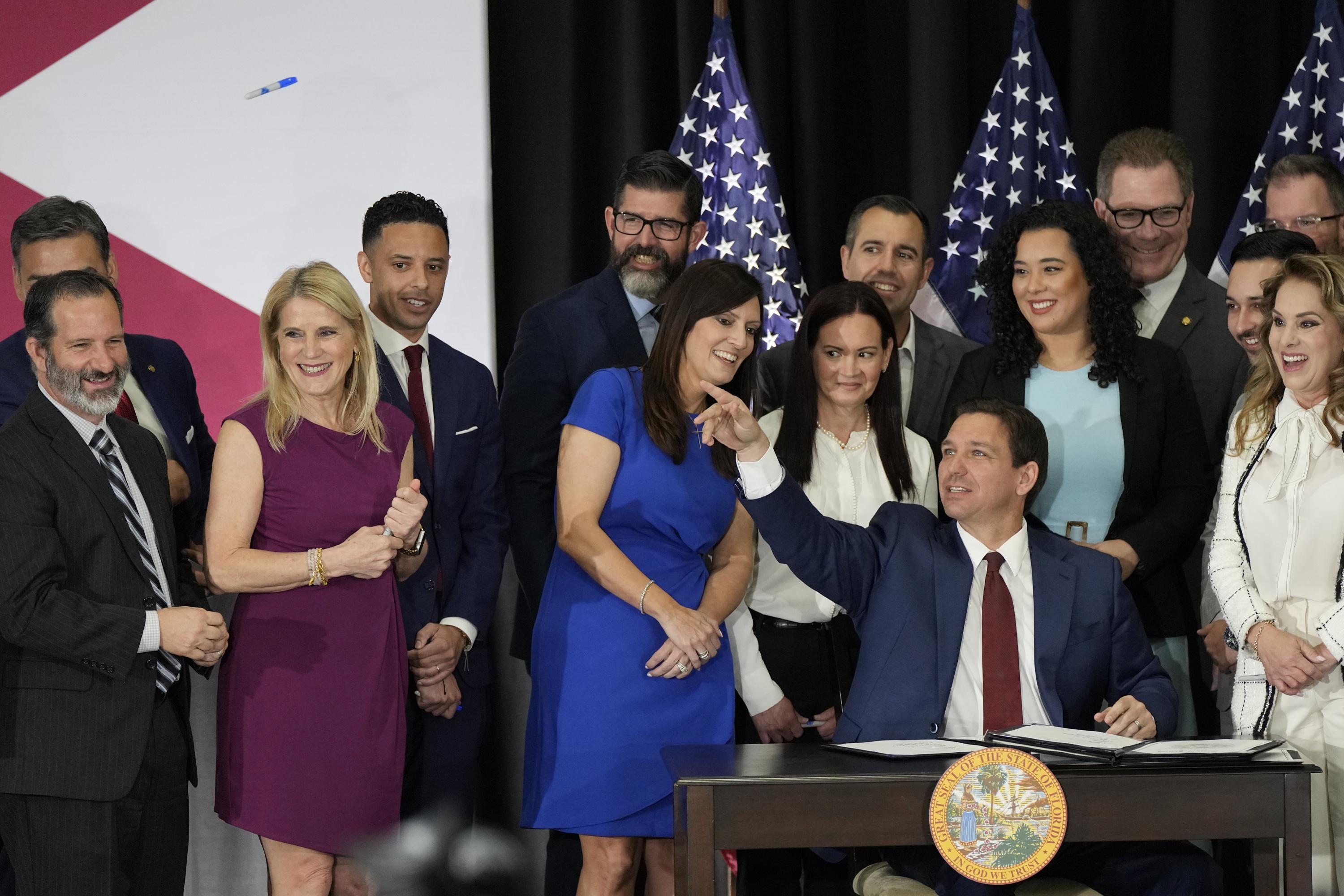 DeSantis signs Florida law restricting public employee unions and ending automatic due payments.