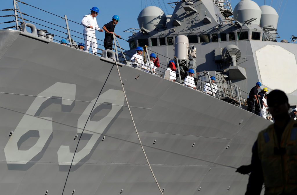 Tensions rise as US warship challenges China's claims in South China Sea.