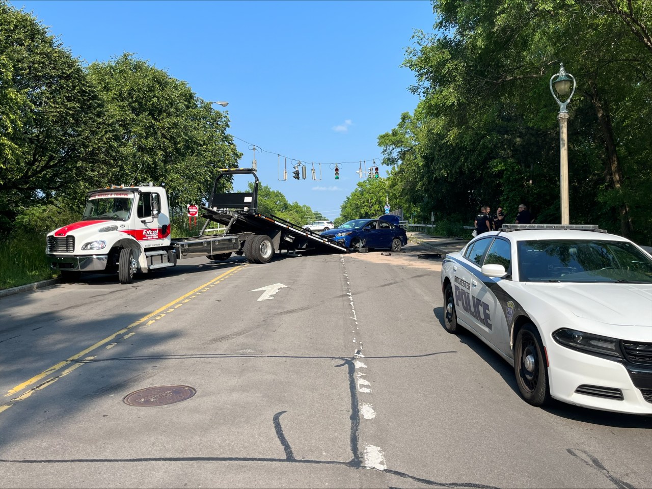 Police search for suspects after stolen car crashes on Elmwood Avenue.