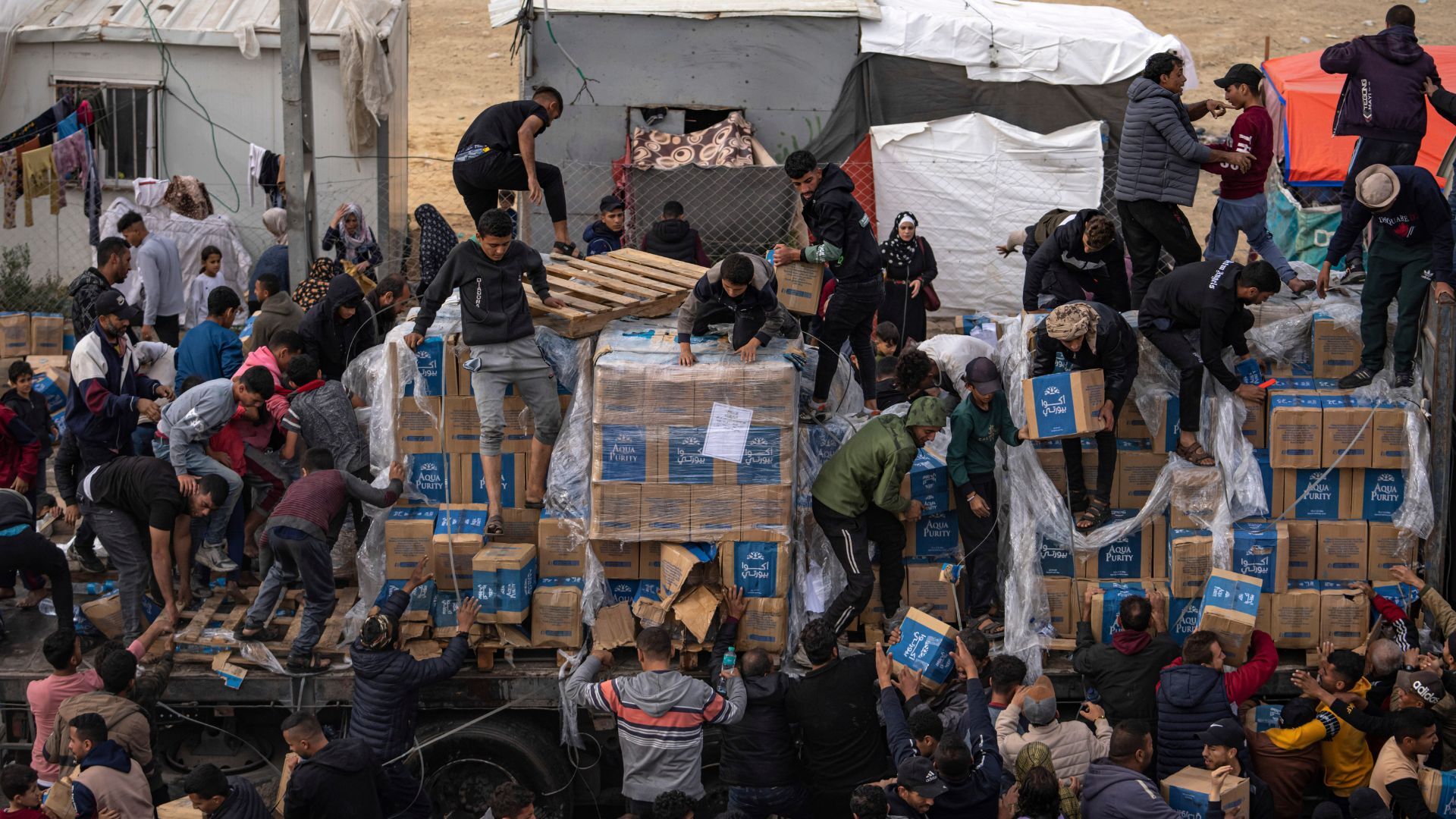 Desperation in Gaza: Starving Palestinians Loot Aid Trucks as Chaos Ensues