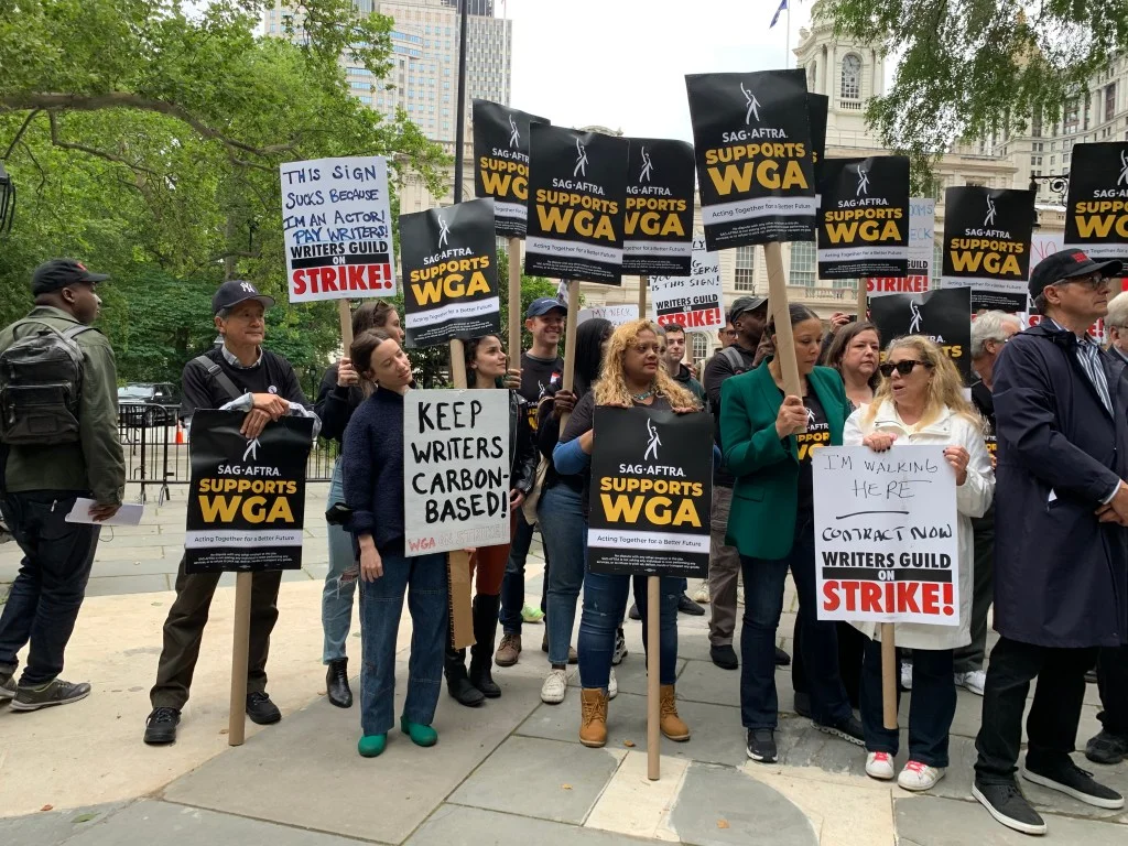 Union solidarity on display as striking writers rally for fair contracts in NYC and LA.