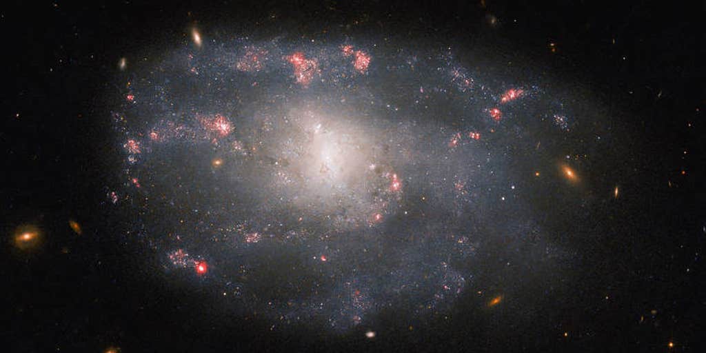 Hubble telescope captures irregular spiral galaxy.