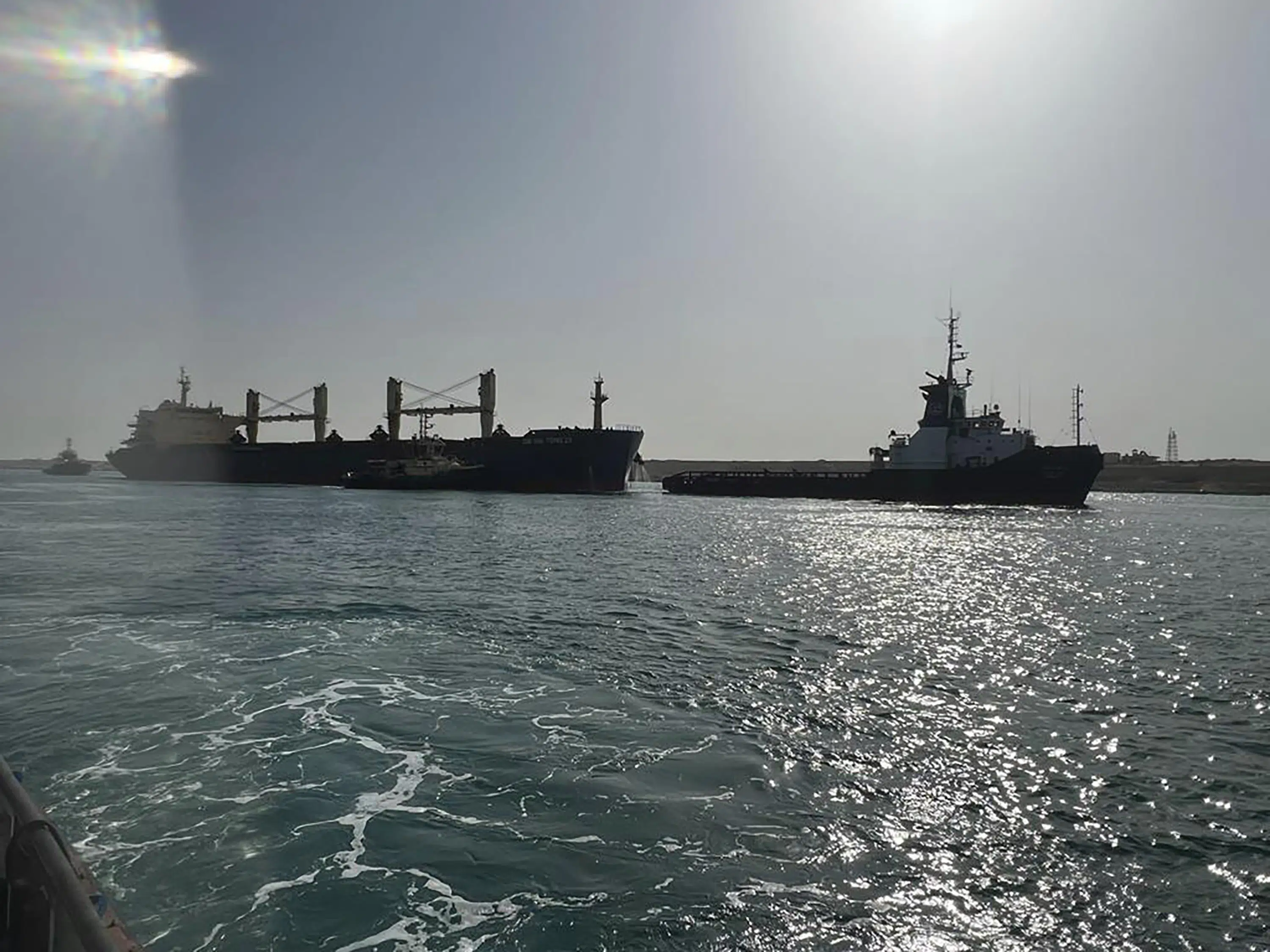 Hong Kong-flagged ship refloated after briefly blocking Suez Canal.