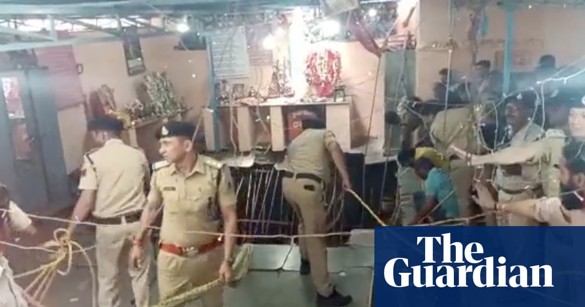 Temple floor collapse in India kills 8 after victims fall into well.