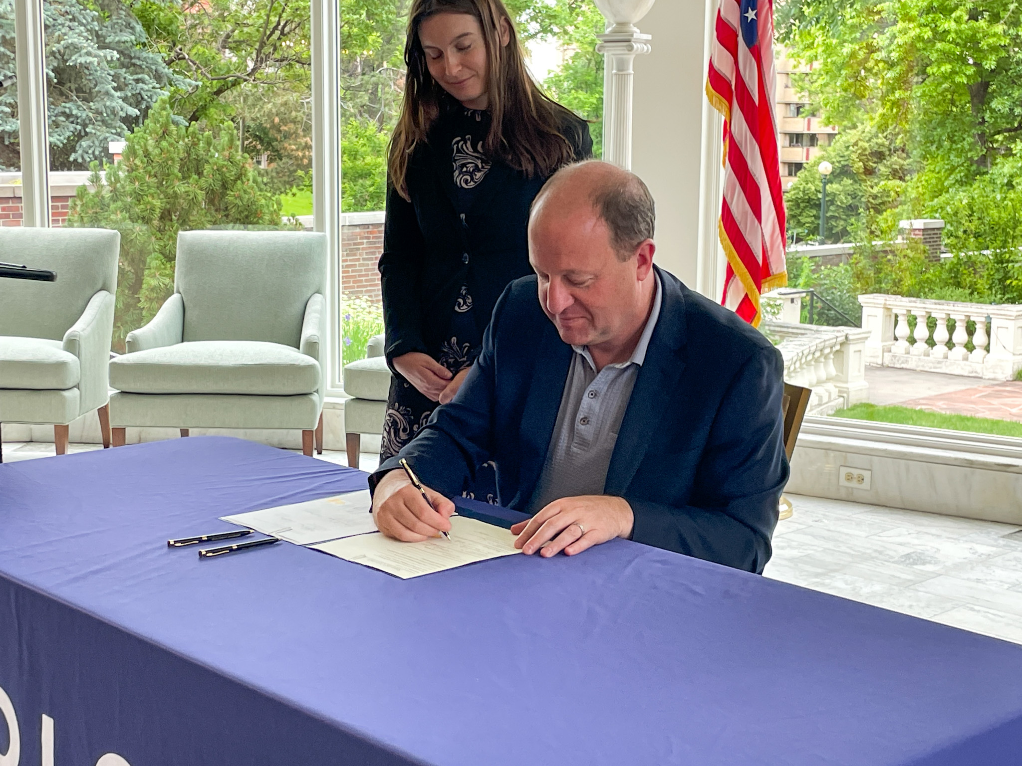 Featured image for "Gov. Polis signs multiple bills into law to protect Coloradans' rights and finances."