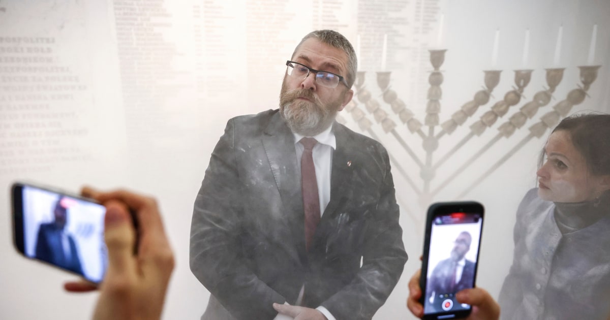 Far-right Polish lawmaker extinguishes Hanukkah candles in parliament with fire extinguisher