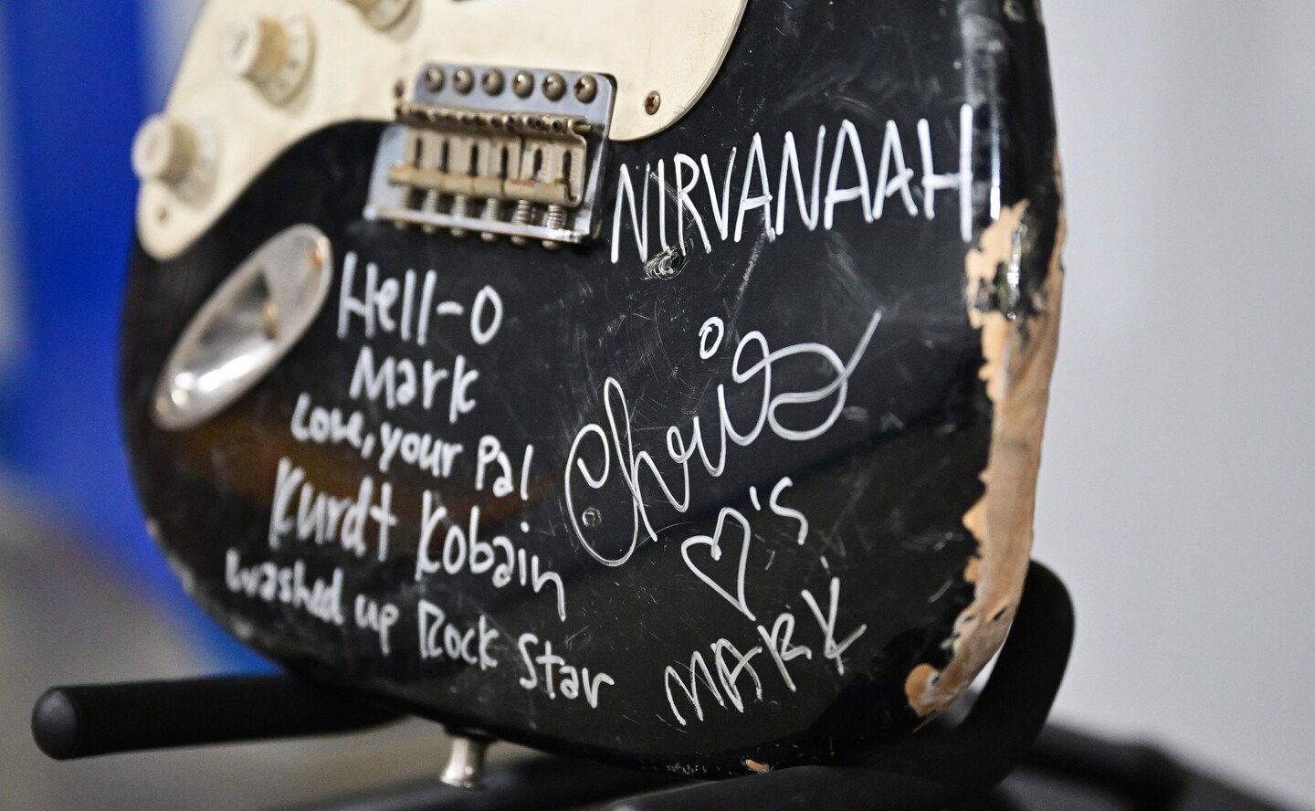 Kurt Cobain's smashed guitar sells for almost $600,000 at auction.