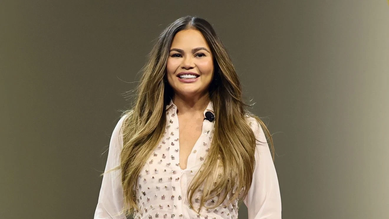 Featured image for Chrissy Teigen Injures Tooth During Christmas Craft