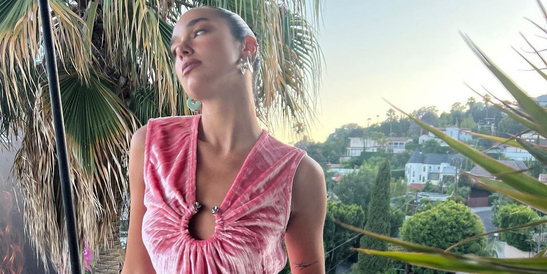 Featured image for "Dua Lipa Rocks Barbiecore Style with Baby Pink Thigh-High Boots"