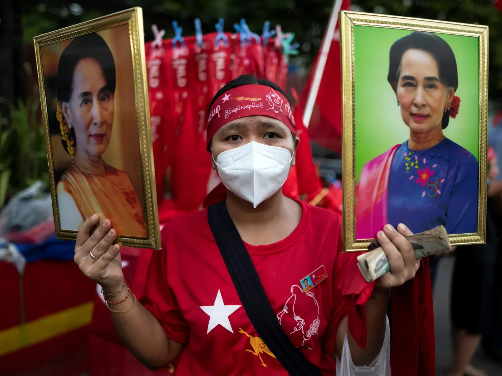 Myanmar military dissolves Suu Kyi's ruling party.