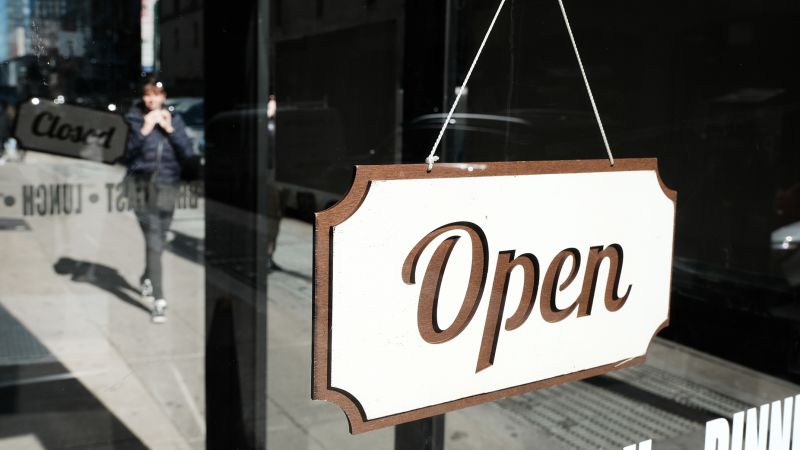 Small business sentiment improves slightly despite inflation and economic concerns.