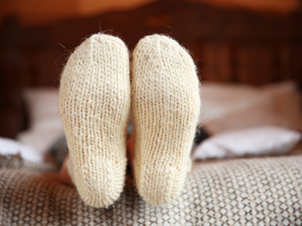 Featured image for "Socks in Bed: Unraveling the Health Debate and Winter Benefits"
