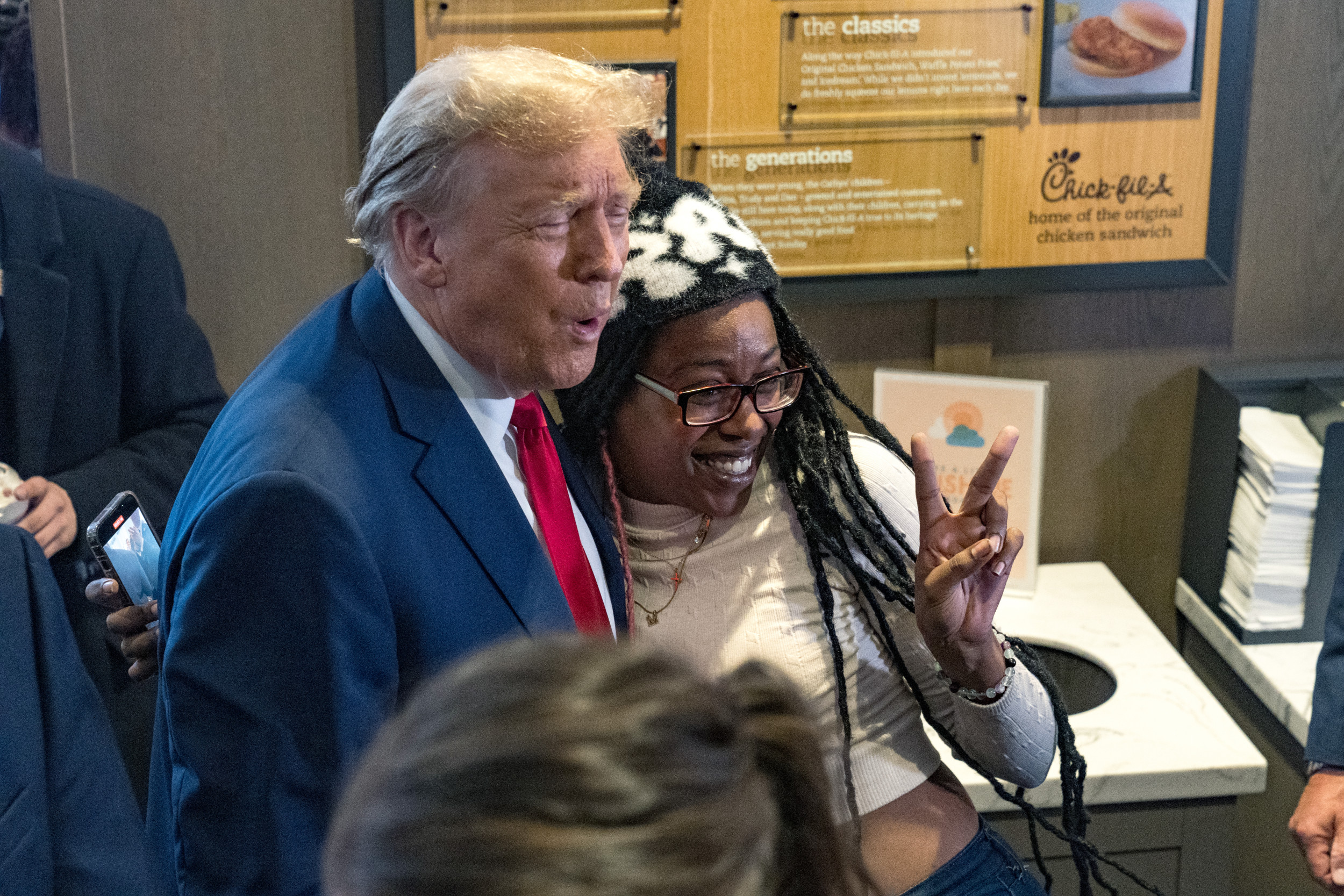 Featured image for "Black Woman's Viral Encounter with Donald Trump at Atlanta Chick-fil-A Sparks Debate"