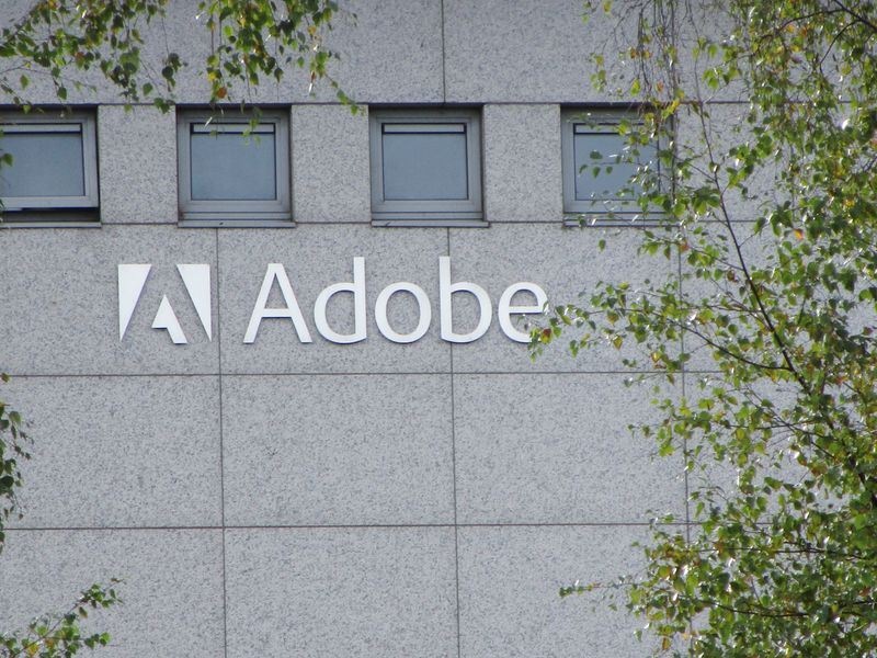 "Adobe's Stock Tumbles on Downbeat Forecast and AI Concerns"