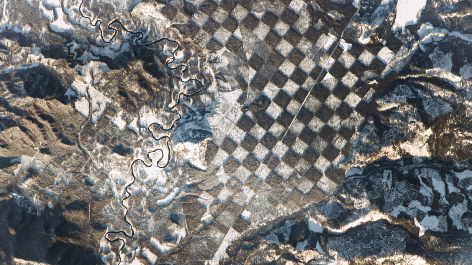 Featured image for Giant Chessboard Encircles Idaho River in Space Photo