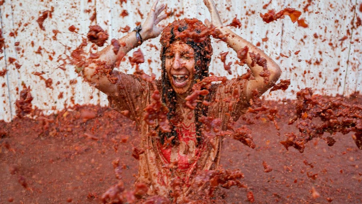 Featured image for "Spain's Tomato-Throwing Festival and More: The World's Must-Visit Festivals in 2021"