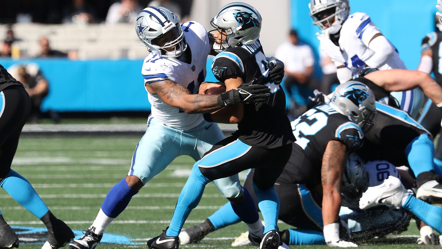 "Parsons and Bland Dominate as Cowboys Crush Panthers 33-10"