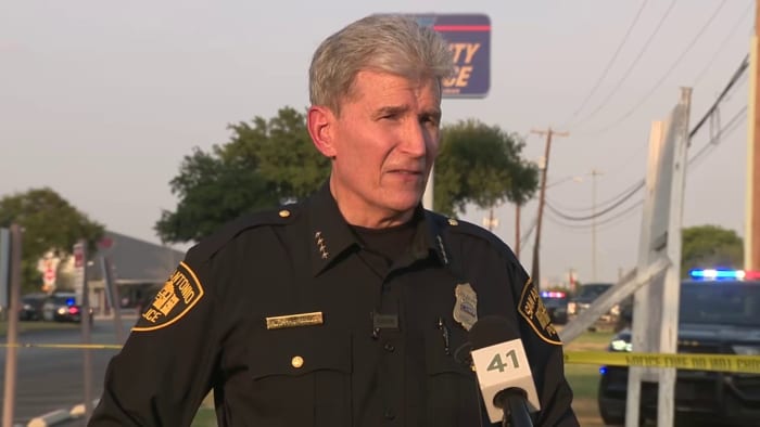 "Standoff in San Antonio: Two Officers Shot in Confrontation with Wanted Suspect"