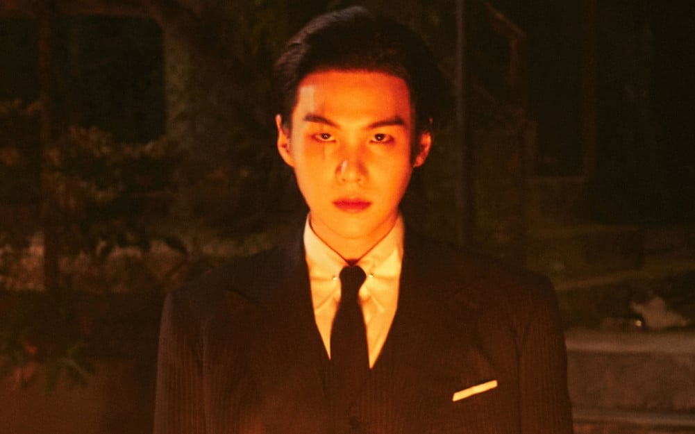 Featured image for BTS Suga dominates Billboard charts with solo and collab tracks.