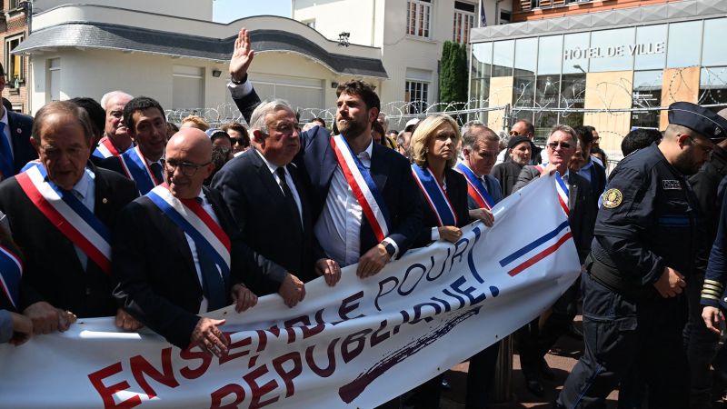 Supporters March with French Mayor Whose Home Was Attacked by Rioters
