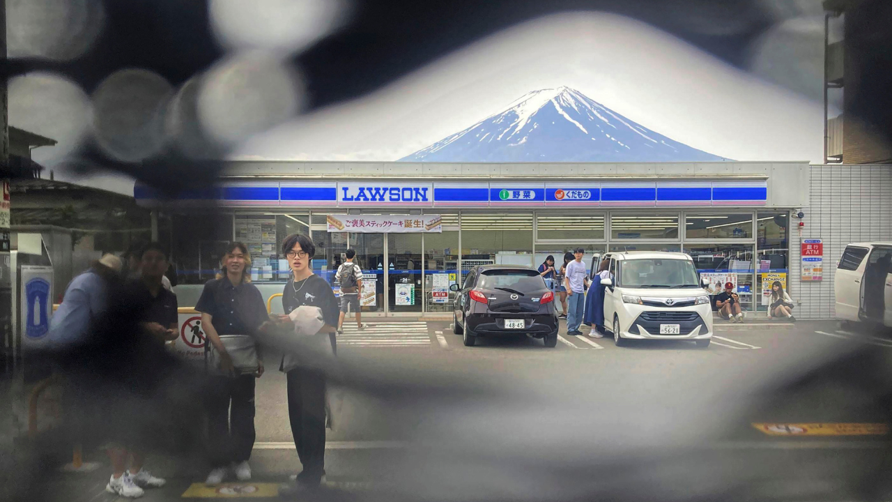 Featured image for Tourists Poke Holes in Mount Fuji Photo Barrier