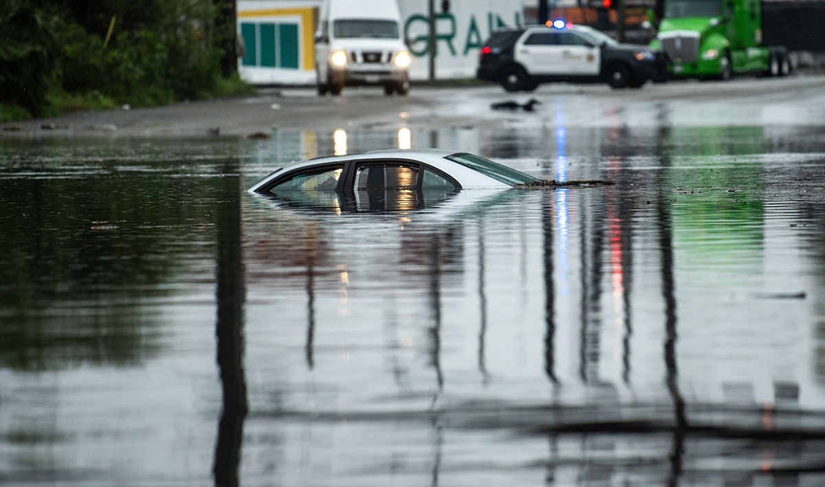 "Long Beach Flooded: Severe Rainstorm Paralyzes City's Streets and Highways"