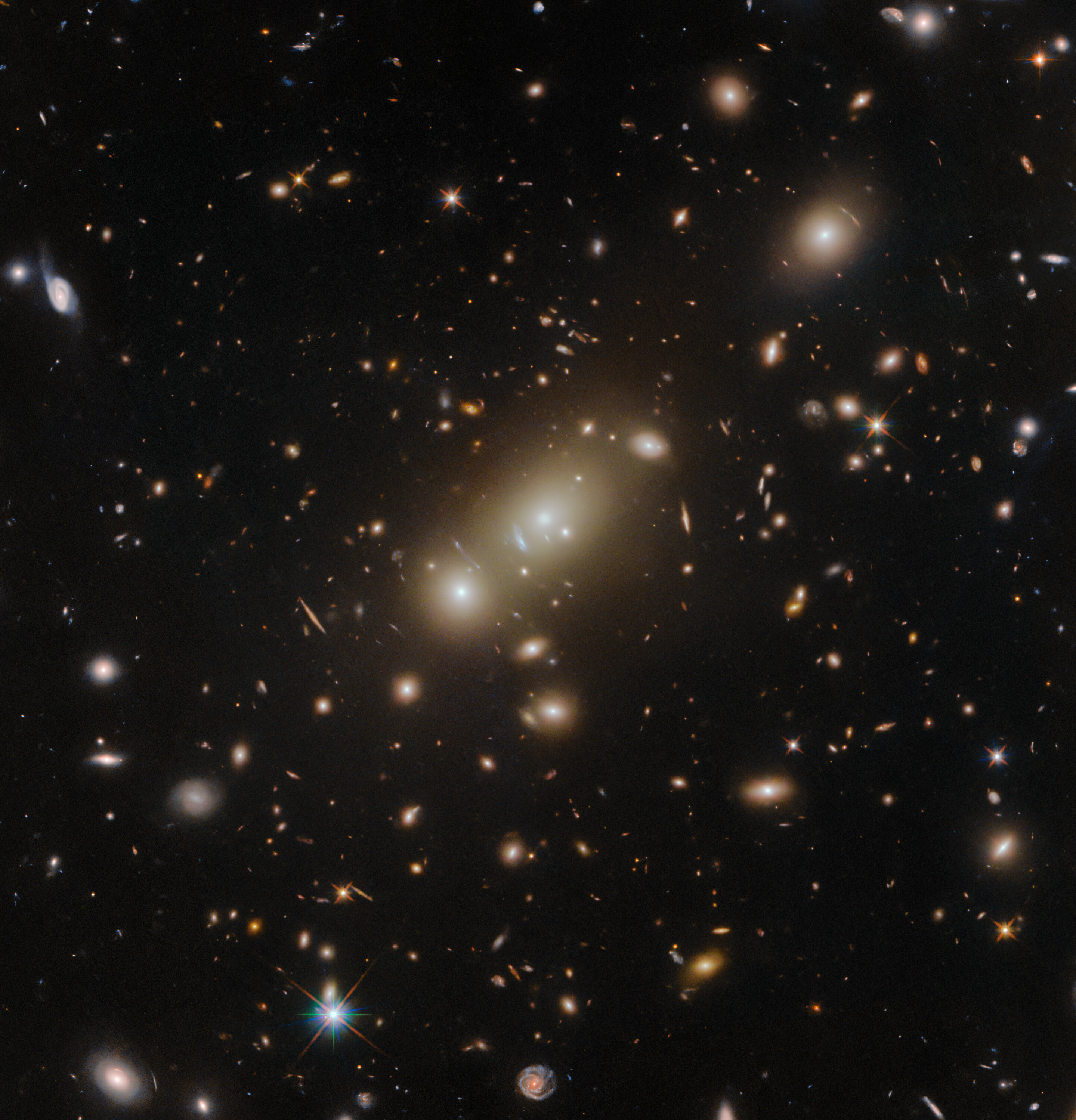 "Hubble's Stunning Infrared Image Reveals Gravitationally Warped Cosmic Cluster"
